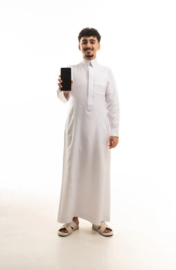 Saudi Man in White Thobe Holding Smartphone