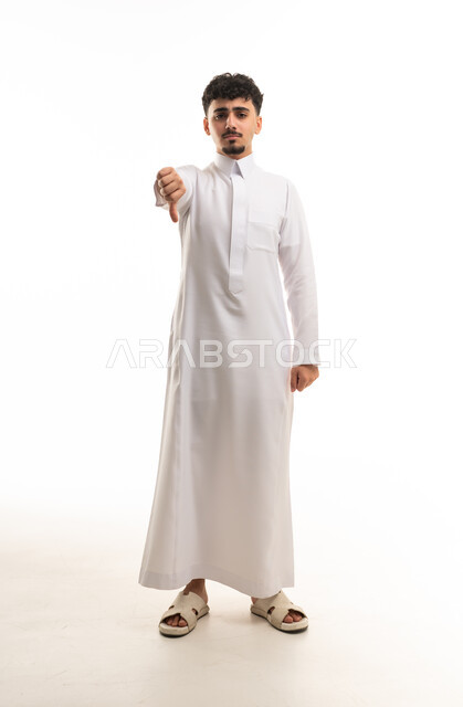 Saudi Man in Thobe Gesturing Thumbs Down