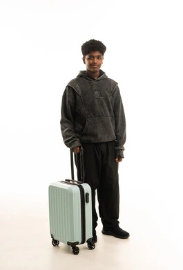 Young African Man with Travel Suitcase on White Background