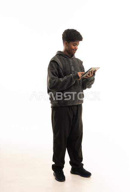 Young Saudi Man Using Digital Tablet on White Background