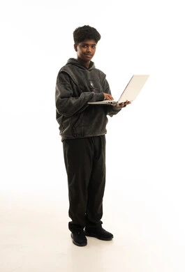 Young African Student with Laptop in Studio