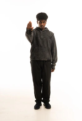 Saudi Young Man Making Stop Gesture in Studio