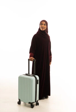 Black Muslim Woman in Maroon Abaya with Blue Suitcase