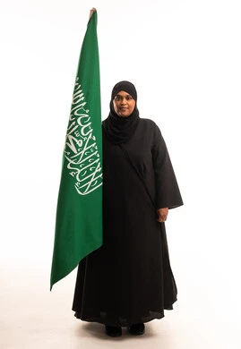 Saudi Woman Holding National Flag on White Background