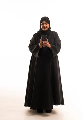 Saudi Woman in Abaya Using Smartphone White Background