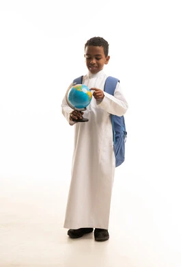 Saudi Schoolboy with Backpack Holding a Globe Studio Shot