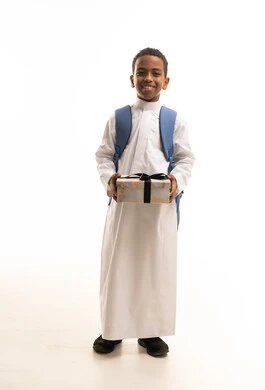 Saudi Boy in Traditional Thobe Holding Gift Box