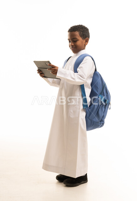 Saudi Boy with Tablet and School Backpack