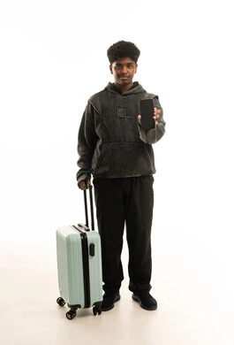 Saudi Man with Travel Suitcase and Smartphone