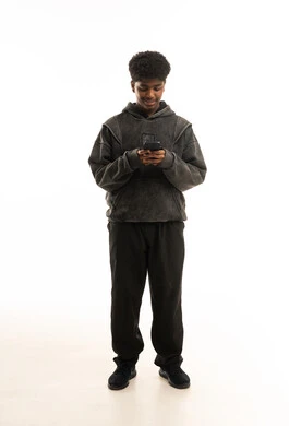 Saudi Youth Using Smartphone on White Background