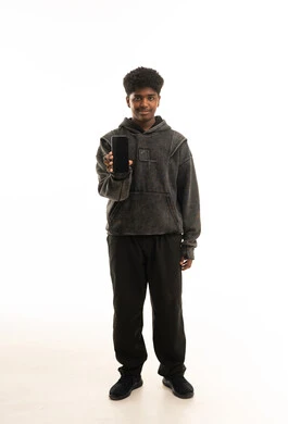 Saudi Boy Holding Smartphone on Plain White Background