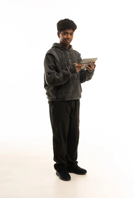 Saudi Teenage Boy Holding Digital Tablet in Studio