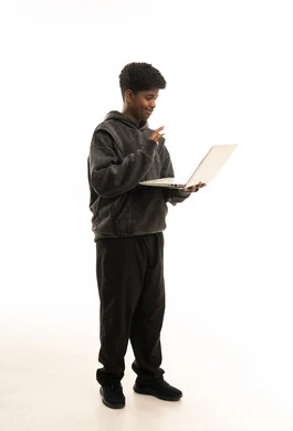 Saudi Boy Waving at Laptop on White Background