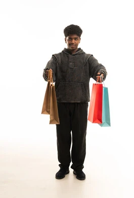 Saudi Youth Holding Shopping Bags on White Background