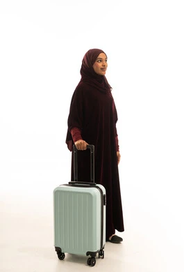 Saudi Woman with Suitcase on White Background