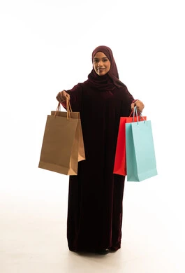 Saudi Woman in Abaya Holding Shopping Bags