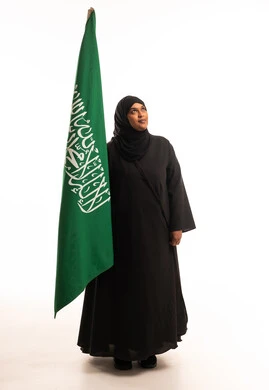 Saudi Woman Holding National Flag on White Background