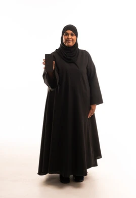 Saudi Woman in Abaya Holding Smartphone in Studio