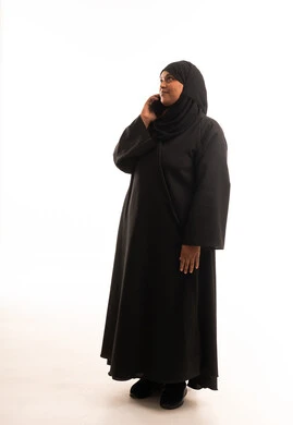 Saudi Woman in Black Abaya Talking on Mobile Phone