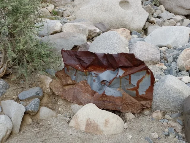 Rusted Metal Waste in Al Baha Rocky Landscape