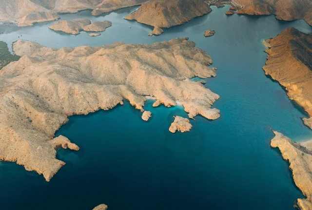 Aerial View of Oman Coastline and Mountains