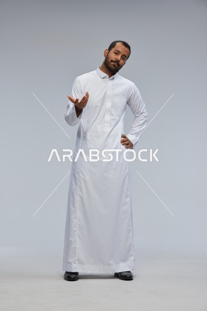 Saudi Man in White Thobe Standing in Studio Portrait