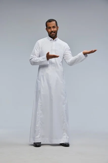 Saudi Man in Traditional Thobe Gesturing in Studio