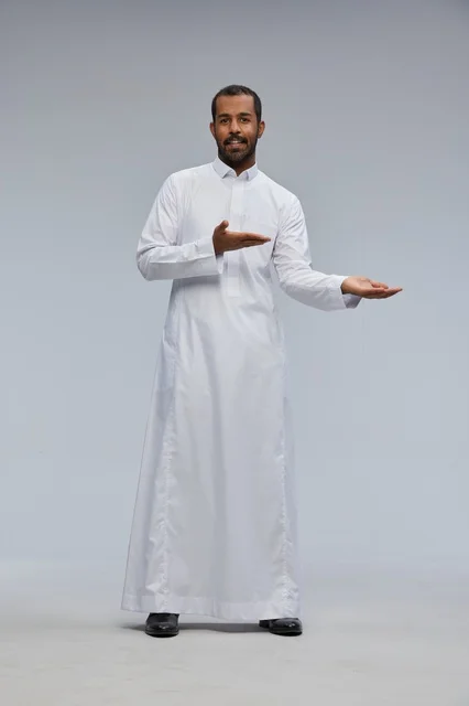 Saudi Man in White Thobe Gesturing in Studio