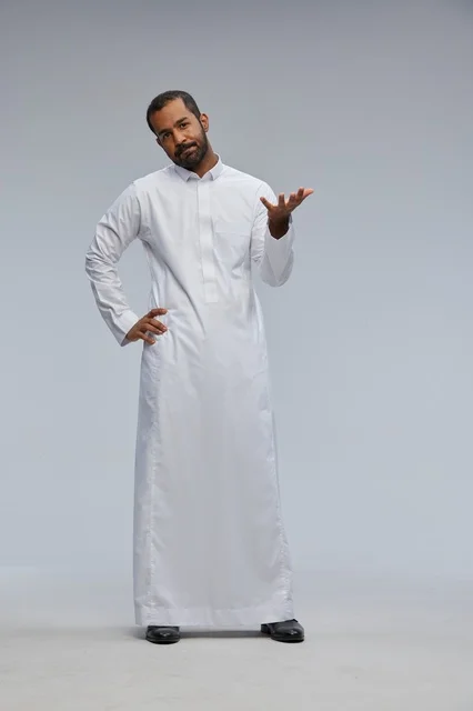Saudi Man in White Thob Gesturing in Studio Full Length