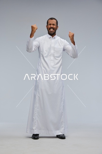 Saudi Man in White Thobe Celebrating Success