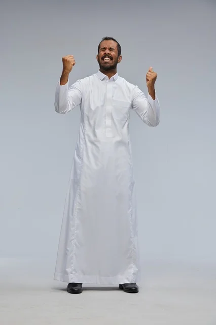 Saudi Man Celebrating Victory in White Thobe
