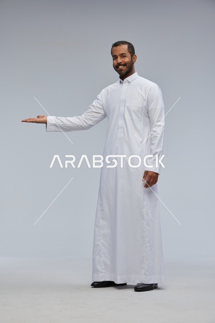 Saudi Man in White Thobe Presenting in Studio