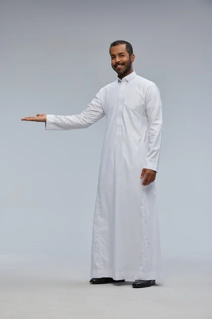 Saudi Man in White Thobe Presenting in Studio