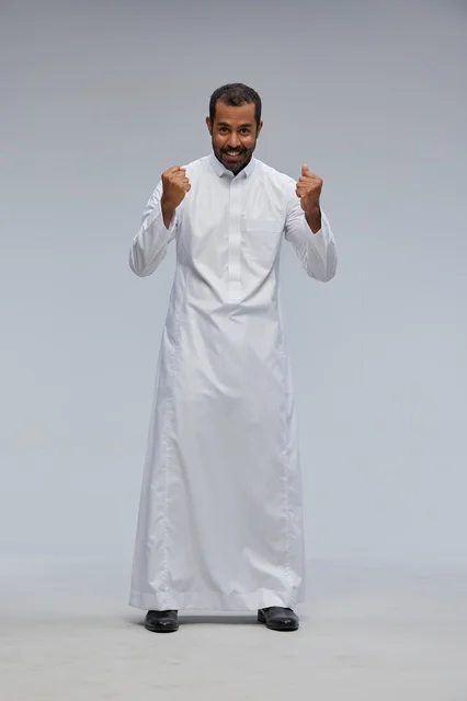 Saudi Man in White Thobe Celebrating Success Portrait