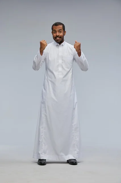 Saudi Man in White Thobe Celebrating in Studio