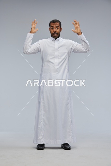 Surprised Saudi Man in Traditional White Thobe Studio Shot