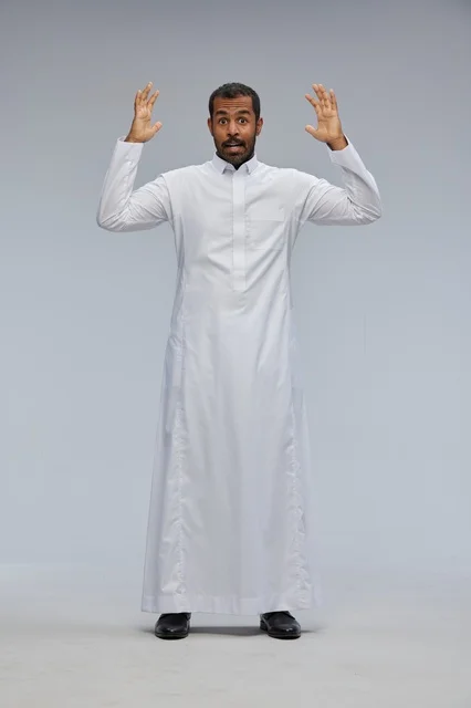 Surprised Saudi Man in Traditional White Thobe Studio Shot