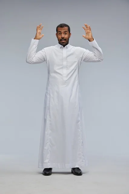Saudi Man in White Thobe with Surprised Studio Expression