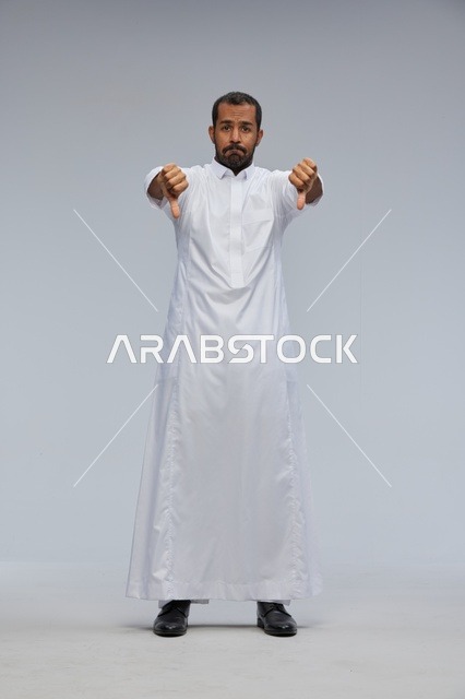 Saudi Man in White Thobe Giving Double Thumbs Down