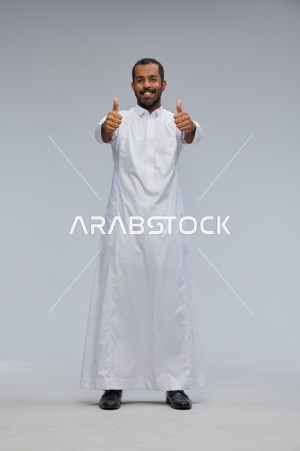 Saudi Man in White Thobe Giving Double Thumbs Up