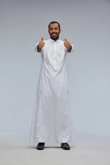 Saudi Man in White Thobe Giving Double Thumbs Up