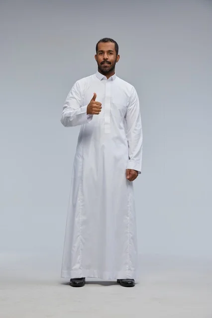 Saudi Man in White Thobe Giving Thumbs Up in Studio