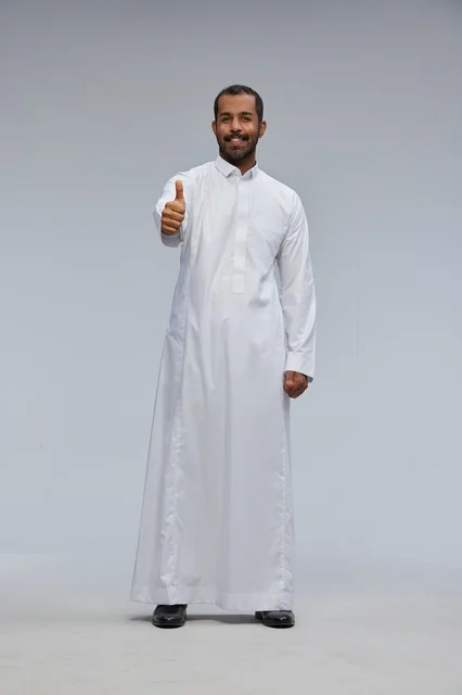 Saudi Man in White Thobe with Thumbs Up Gesture