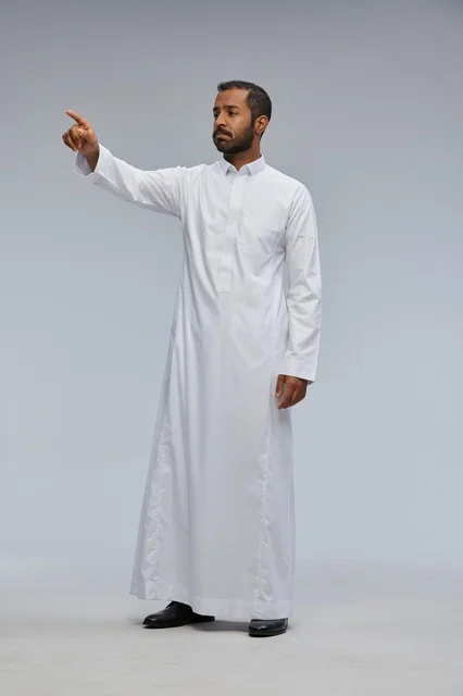 Saudi Man in White Thobe Pointing in Studio