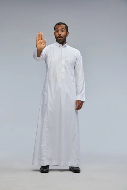 Saudi Man in White Thobe Making Stop Gesture Studio