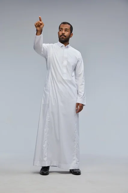 Saudi Man in White Thobe Pointing in Studio