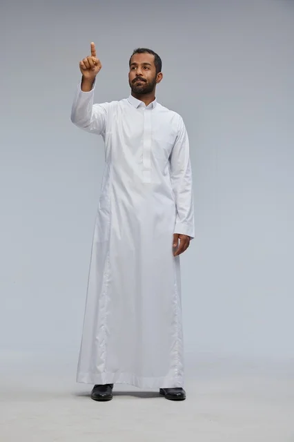 Saudi Man in White Thobe Pointing in Studio