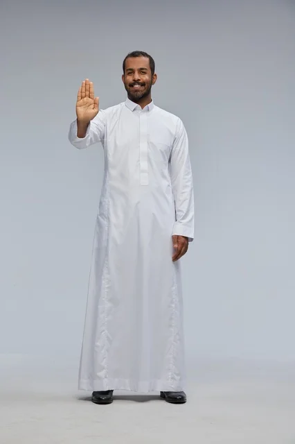 Saudi Man in White Thobe Making Stop Hand Gesture