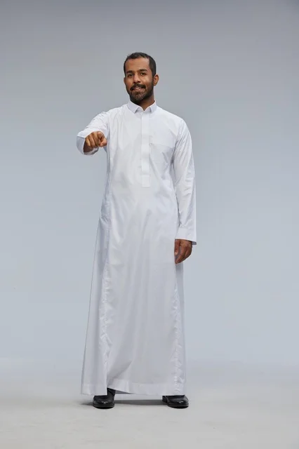 Saudi Man in White Thobe Pointing at Camera Studio