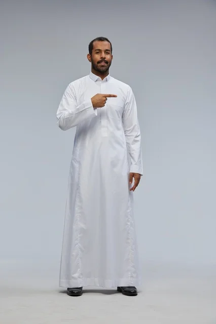 Saudi Man in White Thobe Pointing in Studio